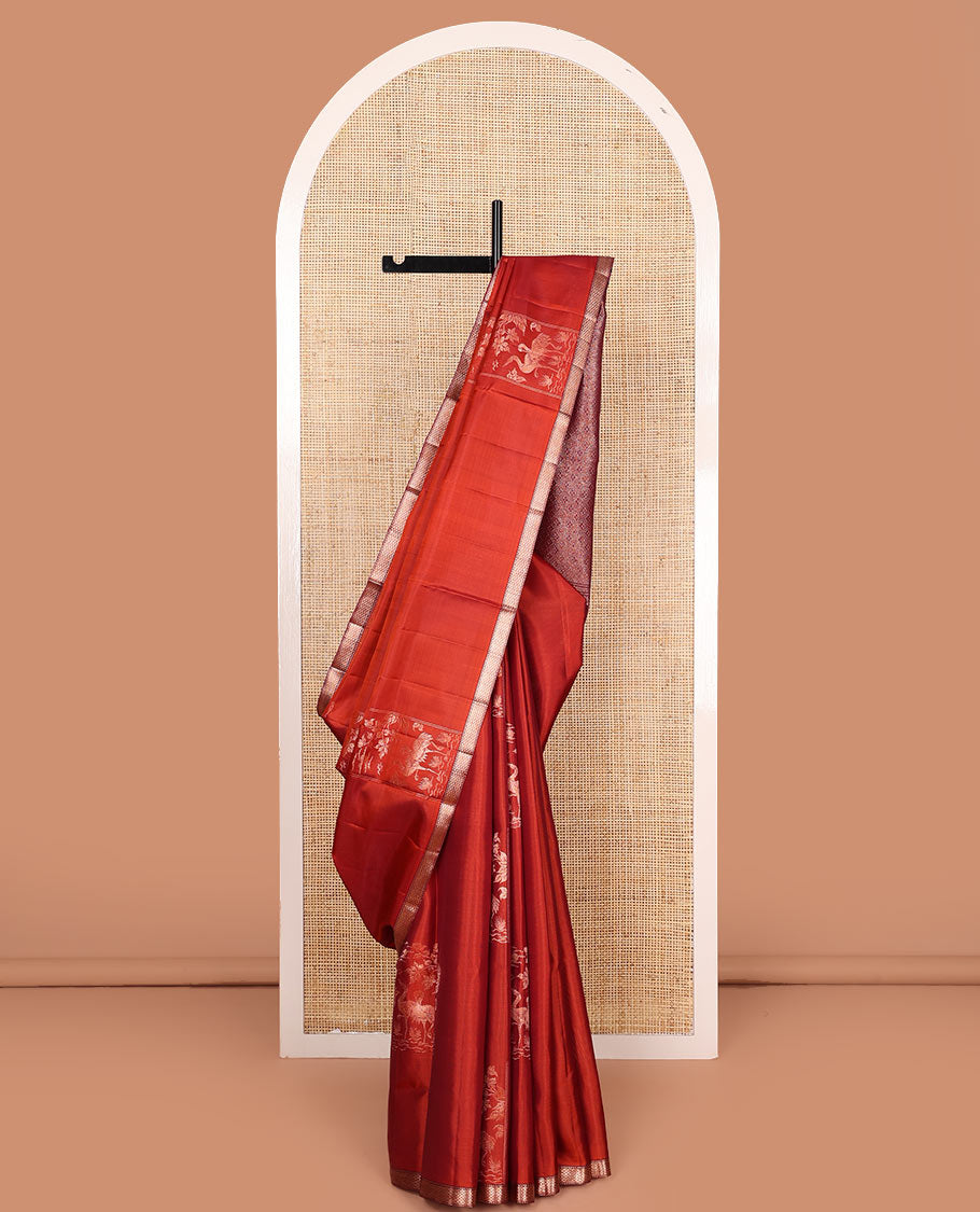 Rust orange bird and floral buttas zari woven soft silk saree, contrast kuyil kann border, and jaal pallu
