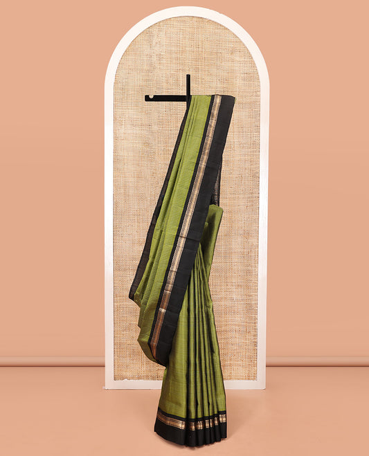 Green Mayuri Lite Silk Mix Saree, Subtly Sparkled with Checks on Its Body, Complemented by a Contrast Kal Eragina Border of Salngai, Muthu, and Then Kuli Nagam Designs, Intricately Designed Pallu, and Paired with a Contrast Blouse