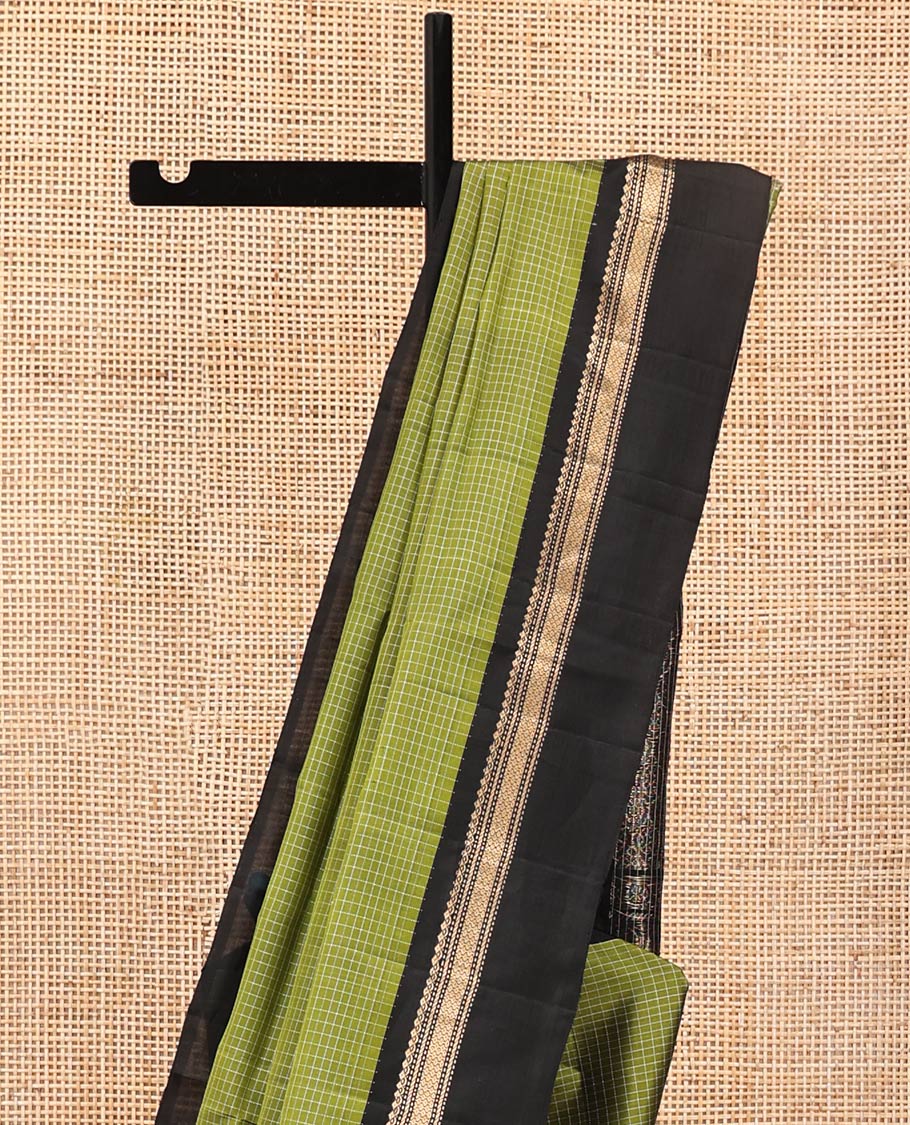 Green Mayuri Lite Silk Mix Saree, Subtly Sparkled with Checks on Its Body, Complemented by a Contrast Kal Eragina Border of Salngai, Muthu, and Then Kuli Nagam Designs, Intricately Designed Pallu, and Paired with a Contrast Blouse