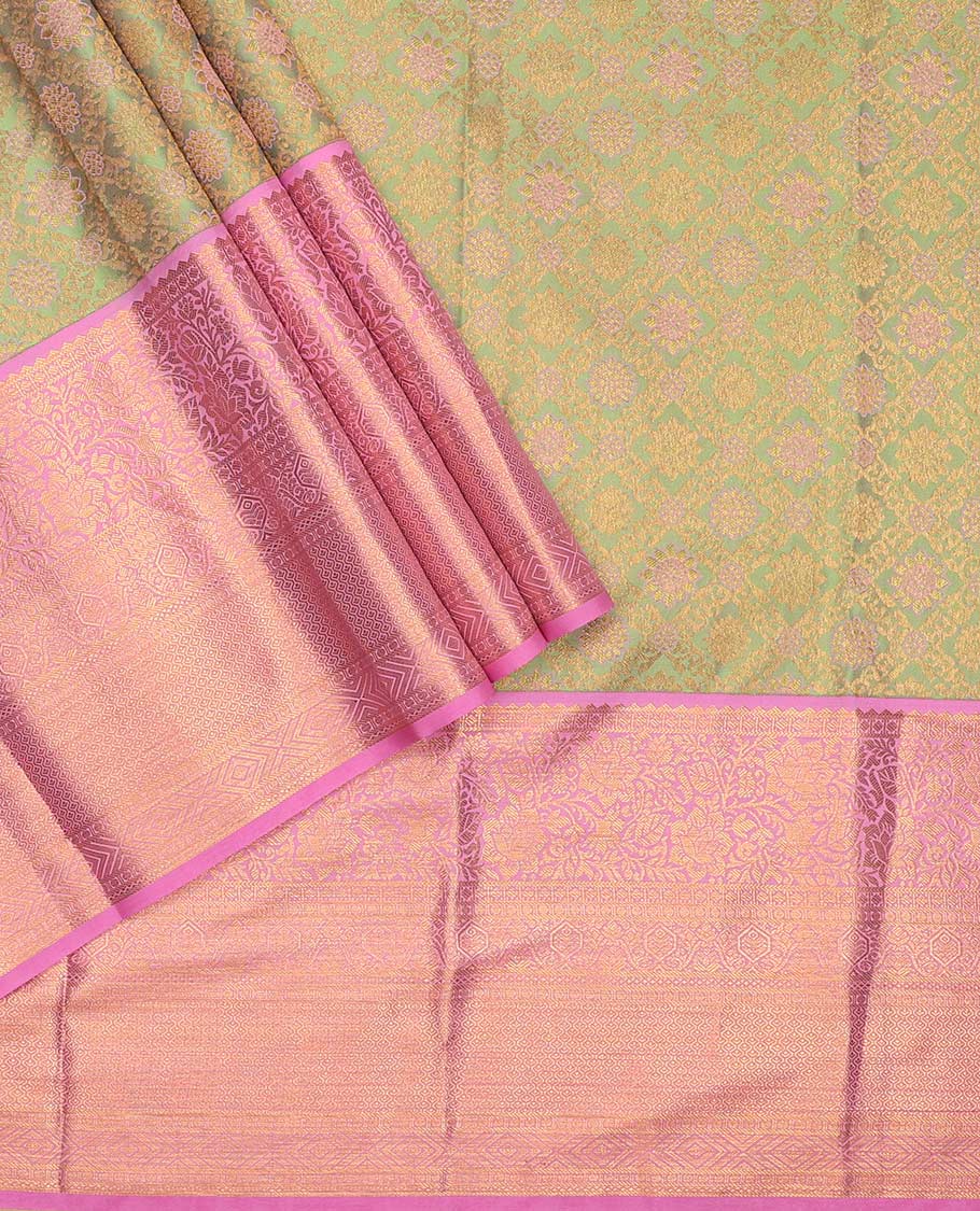 Green pure-silk half saree, jaal jacquard with contrast traditional zari bordered skirt, blouse of rekku, paisa, banaras, rekku, diamond, and then kuli kann, and intricate dhavani