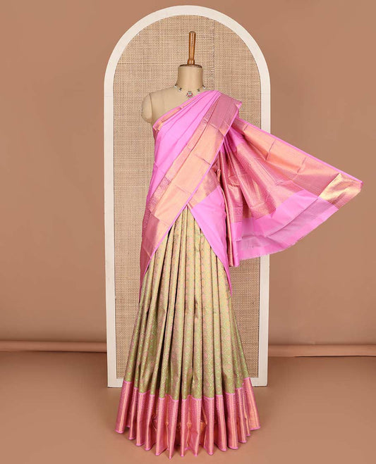 Green pure-silk half saree, jaal jacquard with contrast traditional zari bordered skirt, blouse of rekku, paisa, banaras, rekku, diamond, and then kuli kann, and intricate dhavani