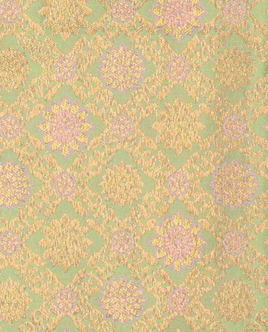 Green pure-silk half saree, jaal jacquard with contrast traditional zari bordered skirt, blouse of rekku, paisa, banaras, rekku, diamond, and then kuli kann, and intricate dhavani