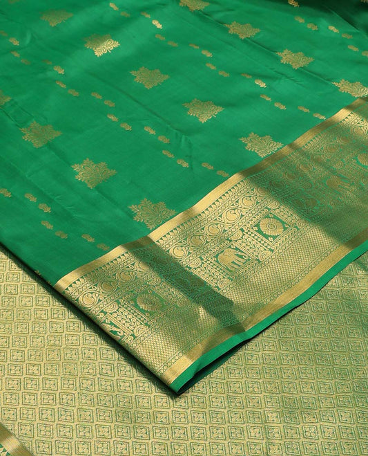 Green zari buttas Vasundhara silk mix saree, zari border of thilakam,diamond,manga, mayil chakram,yaanai, and mayil kann, and jaal pallu