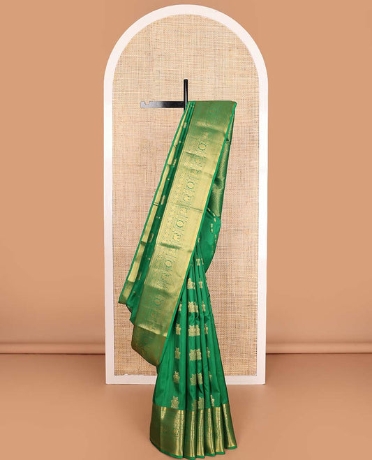 Green zari buttas Vasundhara silk mix saree, zari border of thilakam,diamond,manga, mayil chakram,yaanai, and mayil kann, and jaal pallu