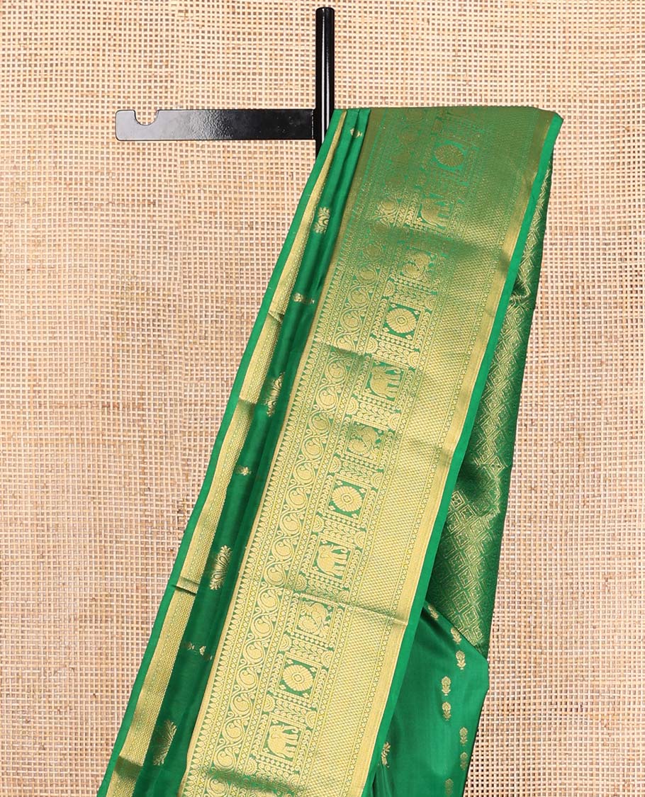 Green zari buttas Vasundhara silk mix saree, zari border of thilakam,diamond,manga, mayil chakram,yaanai, and mayil kann, and jaal pallu