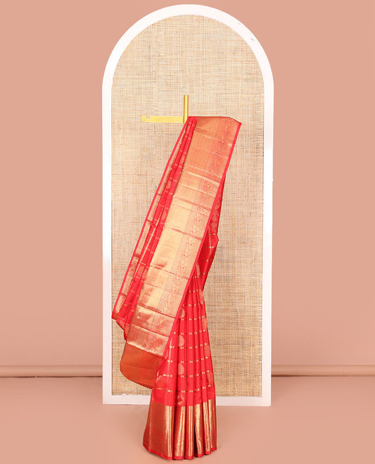 Red Vasundhara Silk Saree Artfully Woven with Zari Butta Enclosed Checks All Over Its Body, Highlighted by Zari Border of Rekku, Mayil Kann, Kathir, and Mayil Designs, a Grand Pallu of Jaal Designs, and Paired with a Matching Blouse