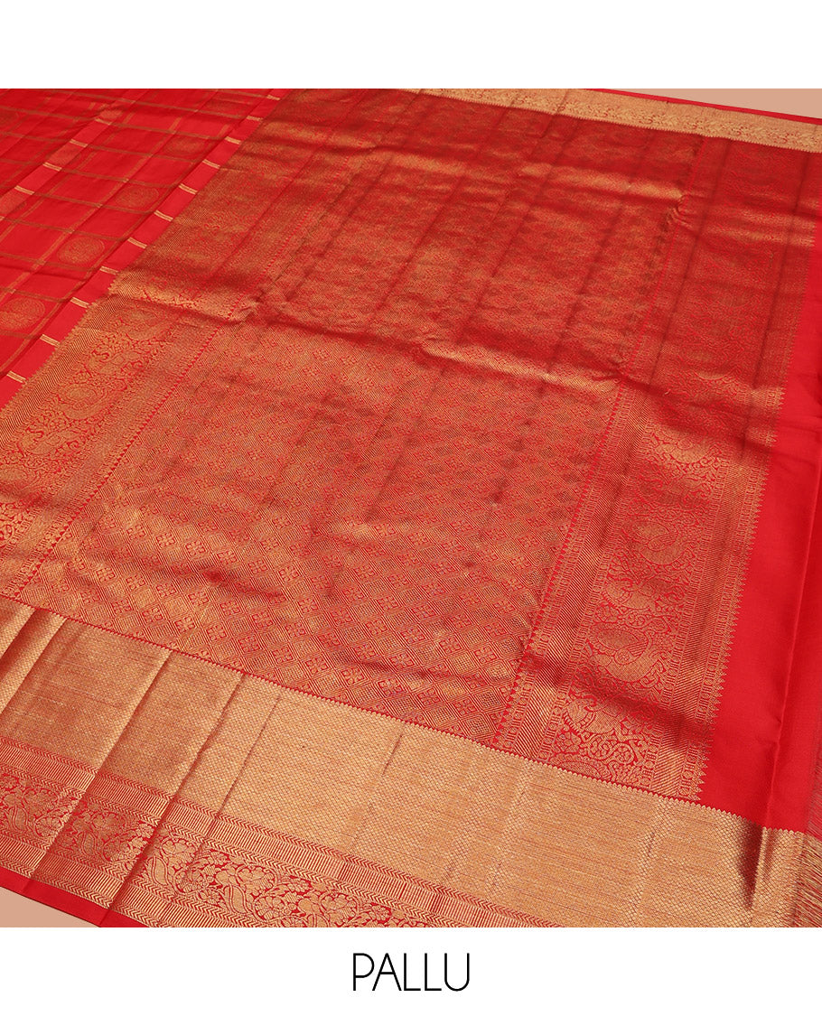 Red Vasundhara Silk Saree Artfully Woven with Zari Butta Enclosed Checks All Over Its Body, Highlighted by Zari Border of Rekku, Mayil Kann, Kathir, and Mayil Designs, a Grand Pallu of Jaal Designs, and Paired with a Matching Blouse