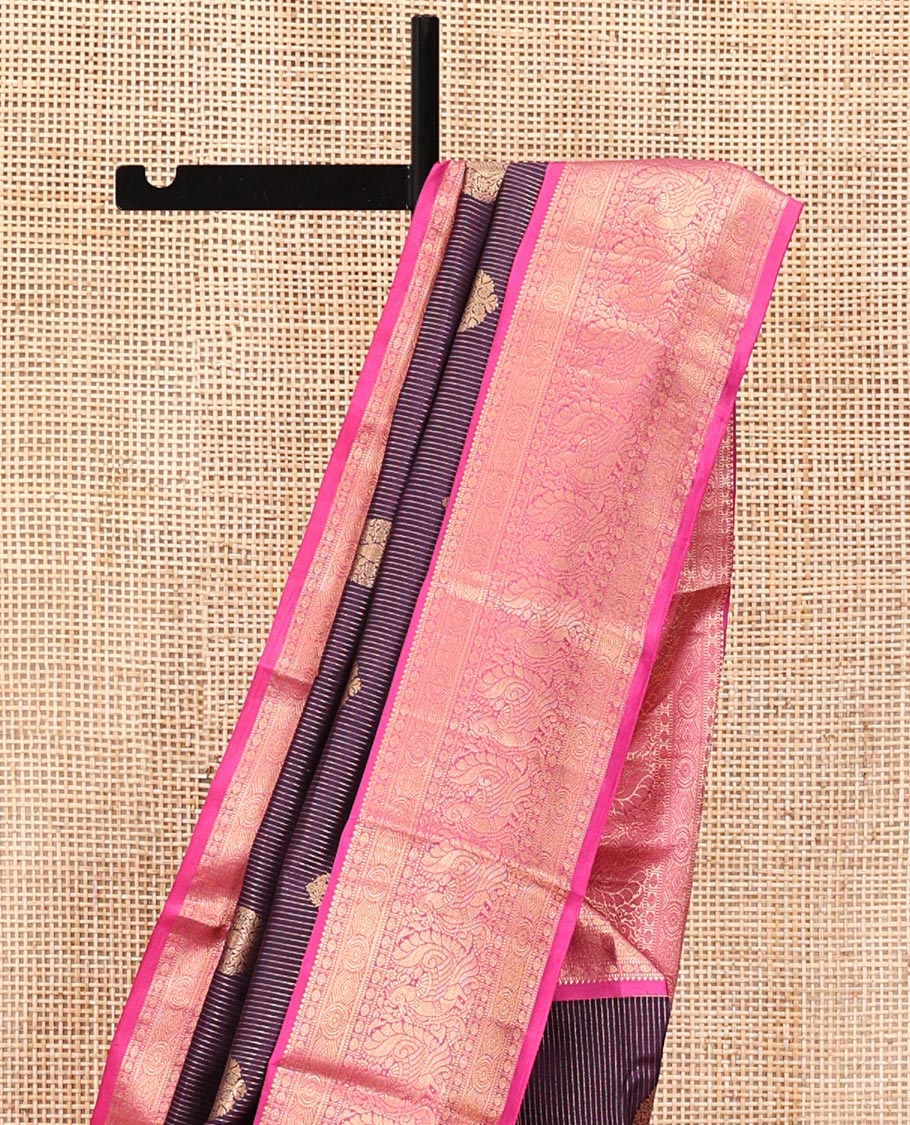 Purple Vasundhara Silk Saree, Detailed with Zari Buttas and Stripes All Over Its Body, Complemented by a Contrast Border of Rekku, Muthu, Poun, Chakram, and Mayil Designs, Grand Manga Design Pallu, and Paired with a Contrast Blouse