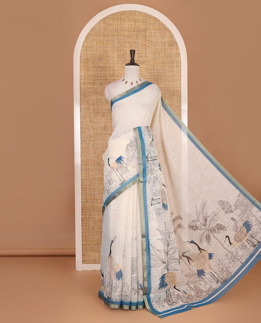 White with blue zari checks linen saree with contrast border and unique designs of pallu along with contrast plain blouse