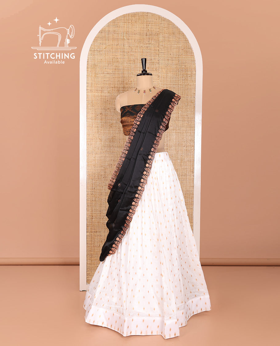 Cream and Black Half-Saree Featuring Gold Zari Buttas Steeped Nylon Viscose Skirt, Complemented by a Contrast Jacquard Zari Design Blouse, and Comes with a Syska Georgette Embroidered Scallop-Bordered Dhavani