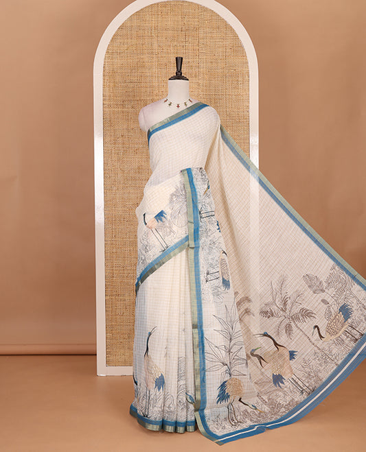 White with blue zari checks linen saree with contrast border and unique designs of pallu along with contrast plain blouse