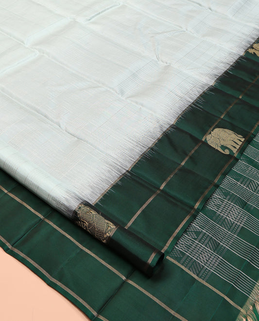 Pale Blue Kanchipuram Silk Saree, Woven with Checks, a Contrast Yaanai-Peacock Buttas Border, Intricate Pallu, and a Contrast Blouse
