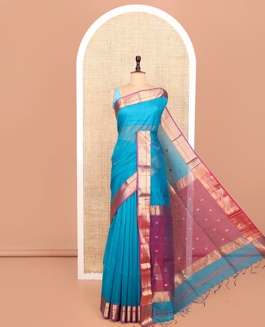 Blue Maheshwari Cotton Saree, Dazzled with Flower Buttas All Over Its Body, Complemented by a Contrast Zari Traditional Design Border, Pallu Steeped with Flower Buttas, and Paired with a Contrast Blouse