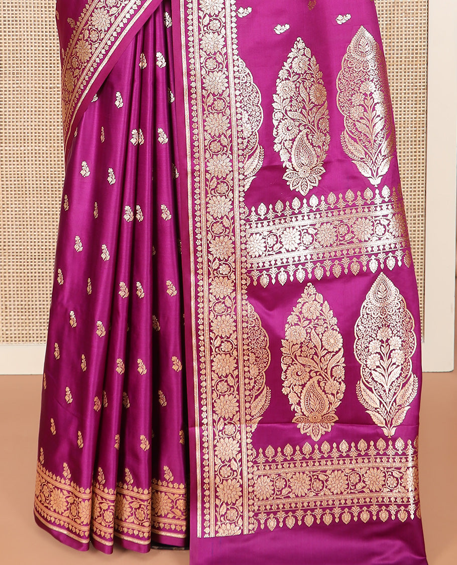 Purple Semi-Banaras Satin Saree Richly Detailed with Zari Buttas, Subtly Sparkled Border of Floral Creeper Designs, Pallu Prettified with Mughal-Style Intricate Motifs in Zari, and Paired with a Matching Blouse