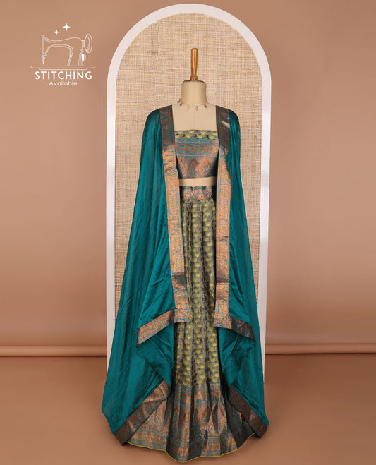 Green geometric design tissue half saree with contrast zari design border, zari design blouse & floral design dhavani