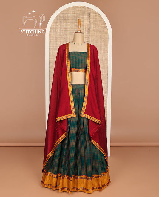 Green checked cotton half saree with contrast zari design border, checked blouse & plain, intricate zari design dhavani