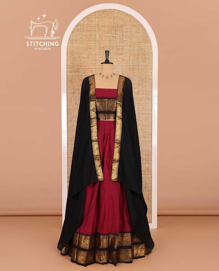 Magenta-black sungudi cotton half-saree, plain with contrast traditional zari varisai pettu bordered skirt, a matching blouse, and a zari bordered dhavani