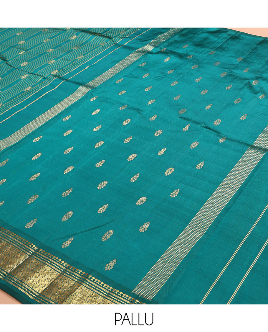 Green Kanchipuram Silk Saree, Subtly Sparkled with Stripes and Buttas, a Zari One-sided Border of Paneer Sombu, Banaras, Muthu, and Jaal Designs, Zari Design Pallu, and No Blouse
