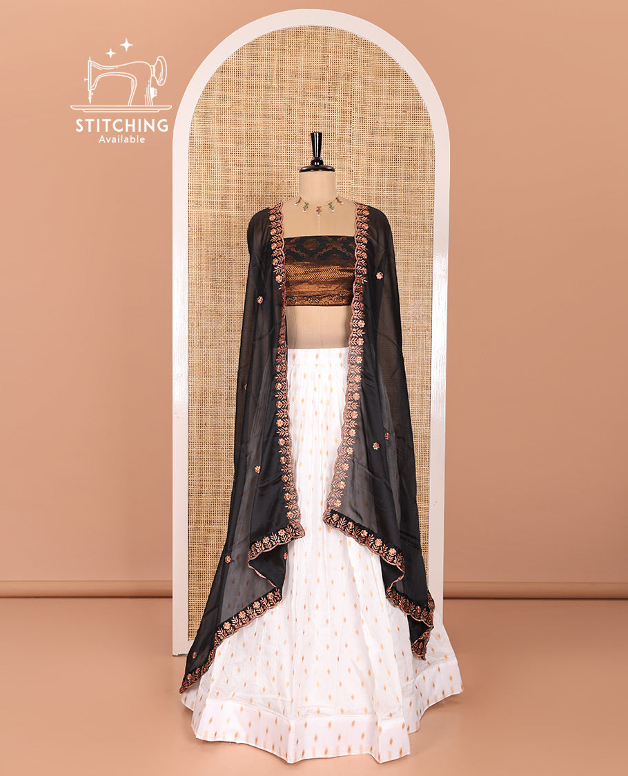 Cream and Black Half-Saree Featuring Gold Zari Buttas Steeped Nylon Viscose Skirt, Complemented by a Contrast Jacquard Zari Design Blouse, and Comes with a Syska Georgette Embroidered Scallop-Bordered Dhavani