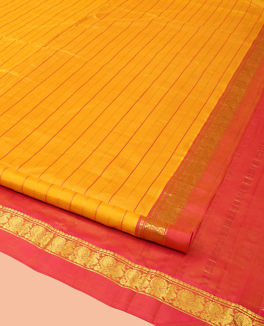 Yellow Kanchipuram Silk Saree Bedecked with Resham Threads Neli Stripes, Elevated with Contrast Kal Erangina Border Featuring Manga, Muthu, and Mayil Designs, Sparsely Woven Pallu, and Paired with a Contrast Blouse