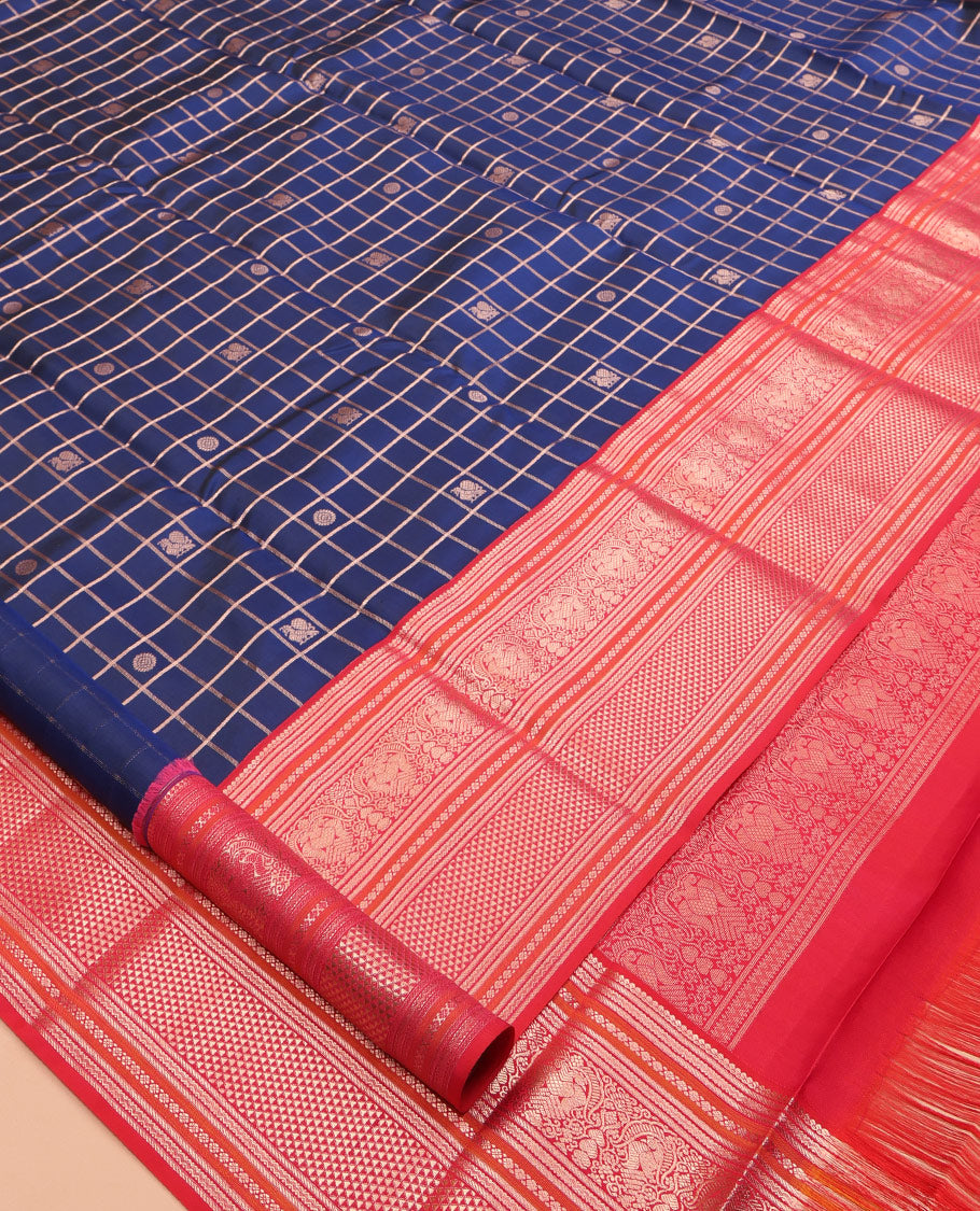 Blue zari checked with annam chakram buttas silk saree, contrast border of thilakam mokku, iruthalai pakshi, and ara maadam designs, and jaal pallu