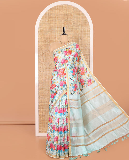 Sky Blue Banana Pith Saree Prettified with Multi-Color Rose Floral Motifs Print, Subtle Small Bavanji Border, Pallu Steeped with Zari Stripes, and Complemented with a Contrast Floral-Printed Blouse