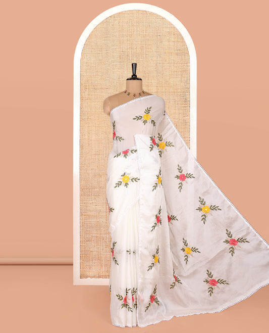 White Rangoli Chiffon Saree, Artfully Embroidered with Floral Motifs in Thread and Stone Work On Its Body, Subtly Sparkled with Lace Border, a Self-Pallu, and Paired with a Contrast Floral Embroidered Blouse