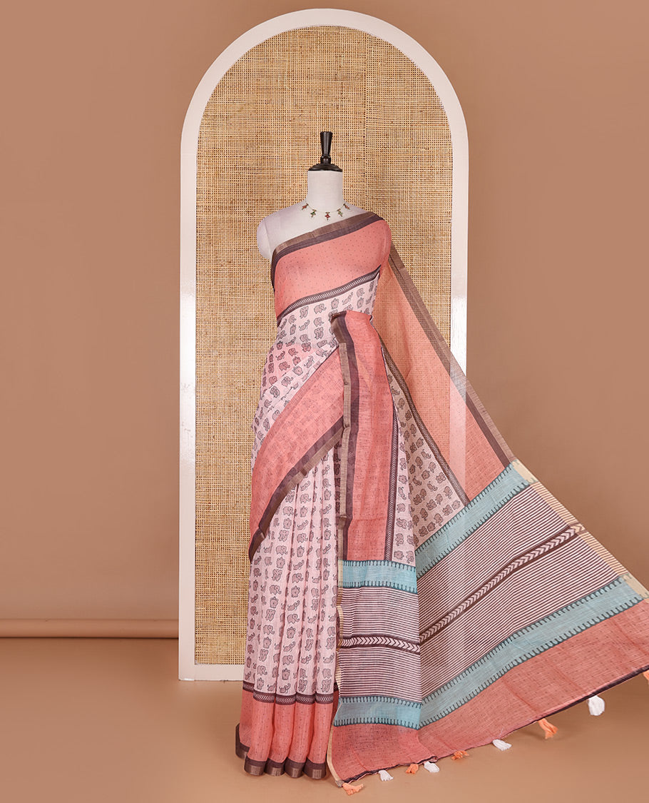 Pastel pink cute elephant motifs printed linen cotton saree, contrast chevron border, pallu of stripes and chevron, and contrast printed blouse