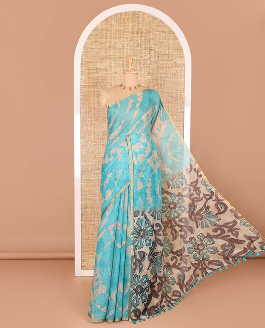 Borderless rama blue batik printed linen cotton saree, hand brush painting style floral vine printed pallu, and contrast floral printed blouse