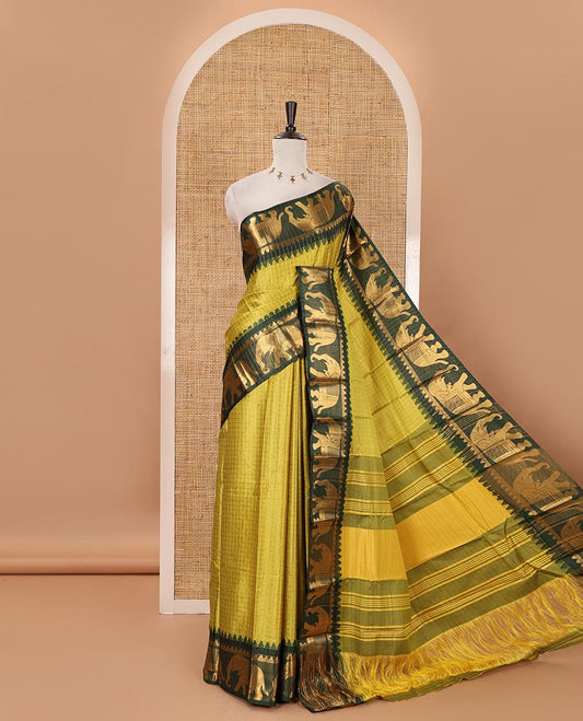 Liril Green checked semi-tafeta saree, contrast temple zari elephant motifs border, striped pallu & matching checked zari border blouse