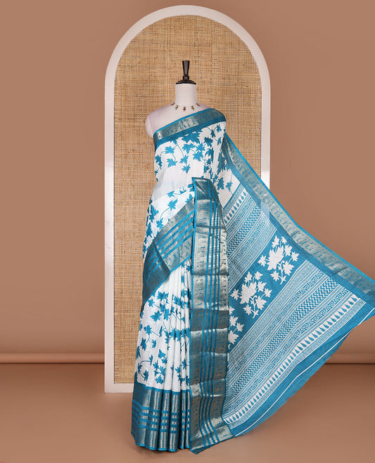 Blue leaf motifs printed dola silk saree, contrast traditional zari border of Rudraksham and peacock motifs, geometric printed pallu and contrast printed blouse