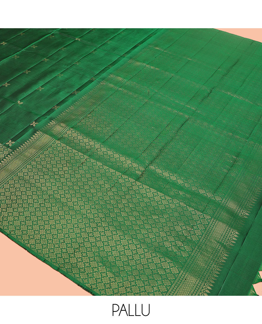 Green Mayuri Soft Silk Saree, Embellished with Zari Buttas All Over Its Body, Highlighted by Zari Border of Kamalam Designs, Pallu of Intricate Designs, and Paired with a Matching Blouse