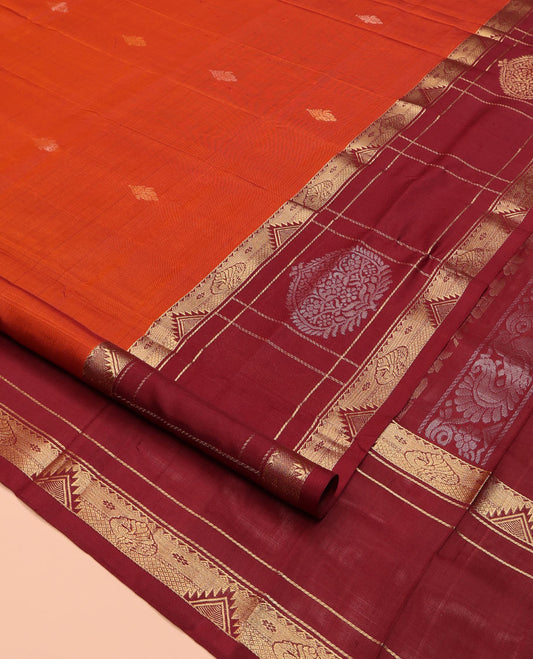 Orange Uppada Silk Saree, Mesmerized with Zari Buttas All Over Its Body, Complemented by a Contrast Traditional Border of Diamond Designs, Pallu Woven with Floral Jaal Designs, and Paired with a Contrast Blouse