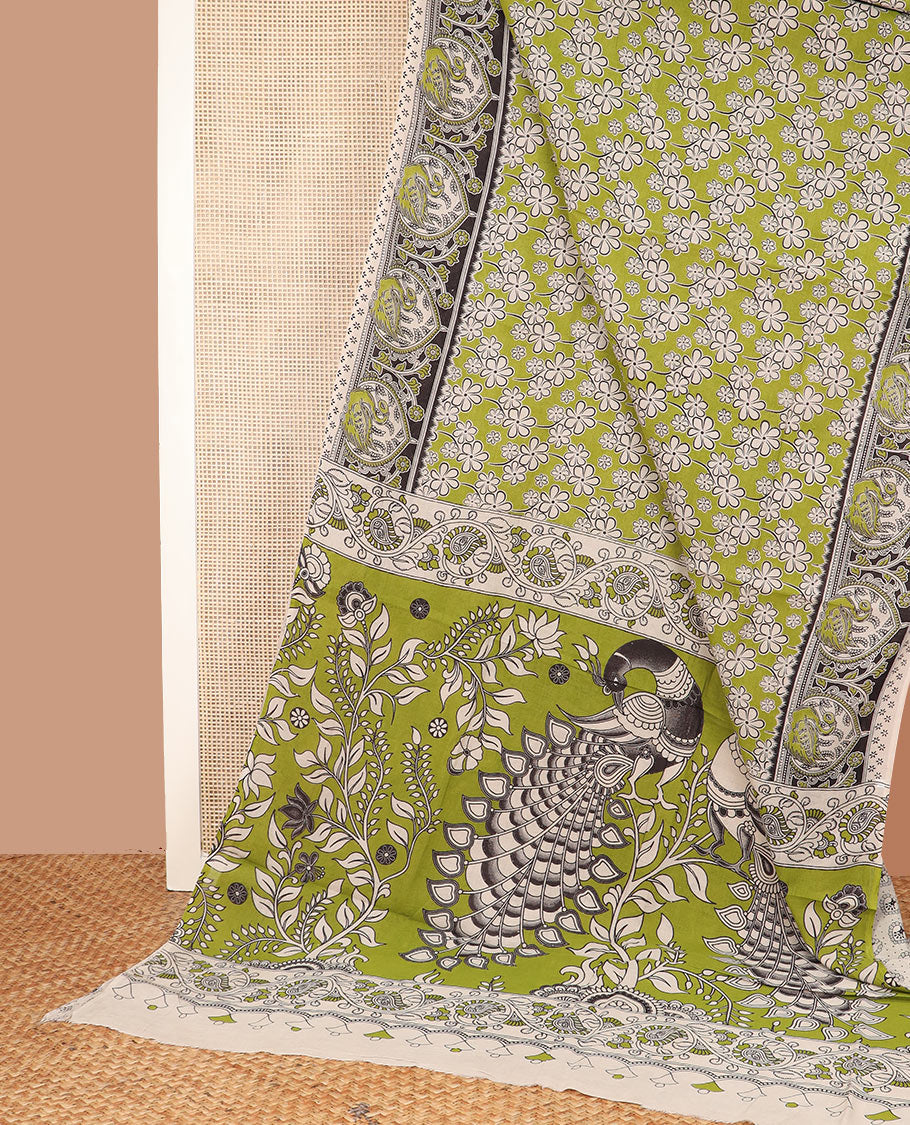 Green floral machine-printed cotton saree, contrast printed border, and pallu of Kalamkari floral and peacocks