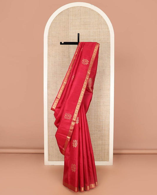 Red Kanchipuram Silk Saree Accentuated with Zari Buttas, Highlighted with Zari Border of Ara Bogudi, Muthu, and Mayil Designs, Grandly Woven Pallu of Jaal Designs, and Paired with a Matching Blouse