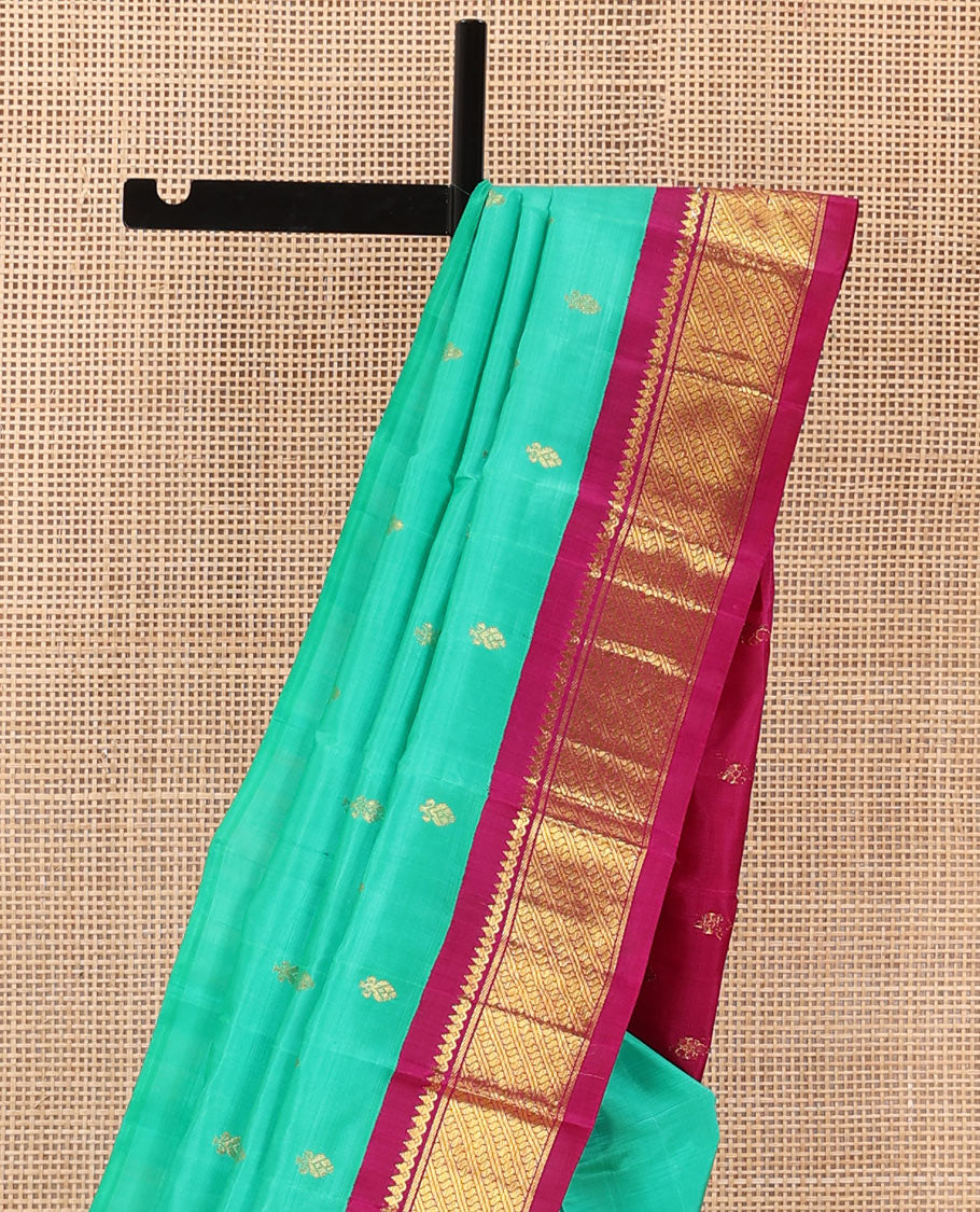 Green zari buttas Kanchipuram silk saree, contrast korvai border of thilakam mokku, and puli nagam, and zari design pallu