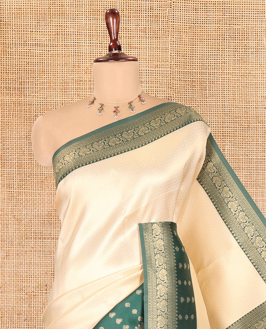Cream-Green Embossed Art Kanchi Silk Saree, a Contrast Traditional Zari Border, Grand Jaal Pallu, and a Contrast Blouse