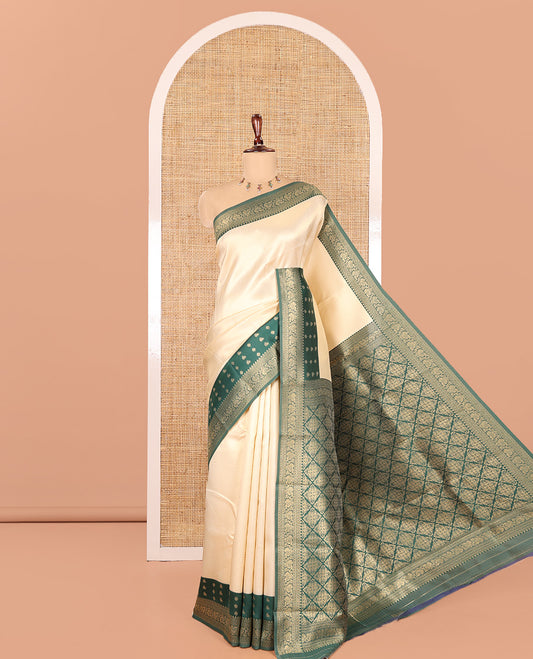 Cream-Green Embossed Art Kanchi Silk Saree, a Contrast Traditional Zari Border, Grand Jaal Pallu, and a Contrast Blouse