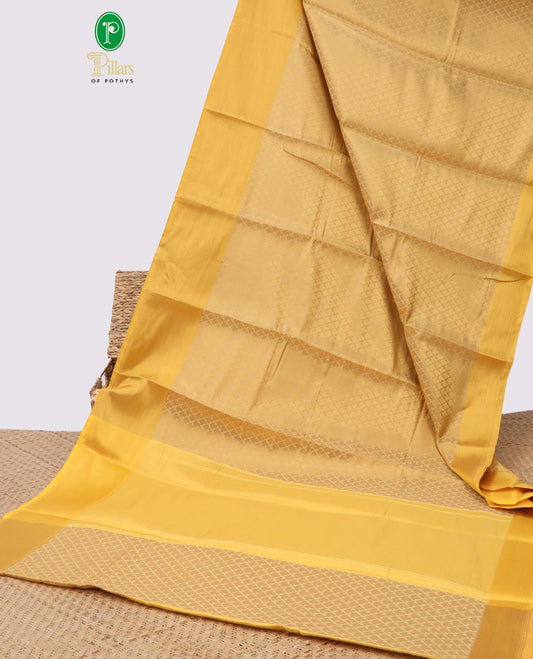 Light yellow leaf design semi tissue saree with contrast striped border & zari design pallu