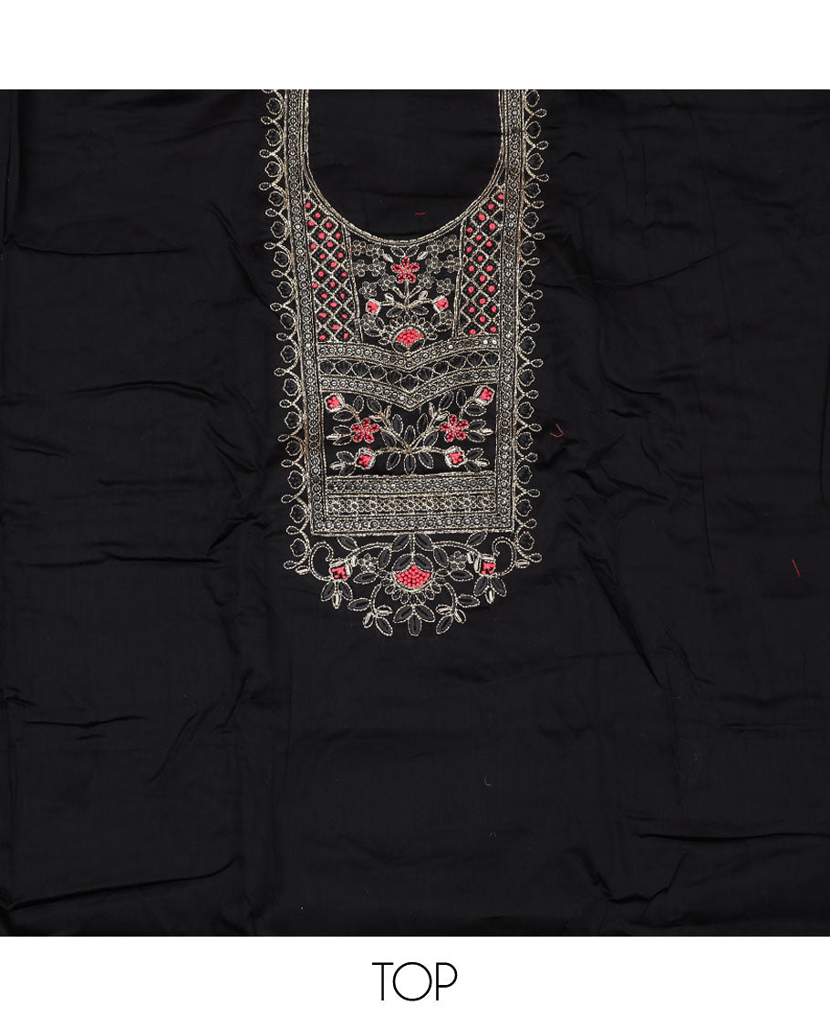 Black material churidar set, neck embroidered top, contrast plain bottom, and a contrast dupatta of bandhani dots, and chakram motifs
