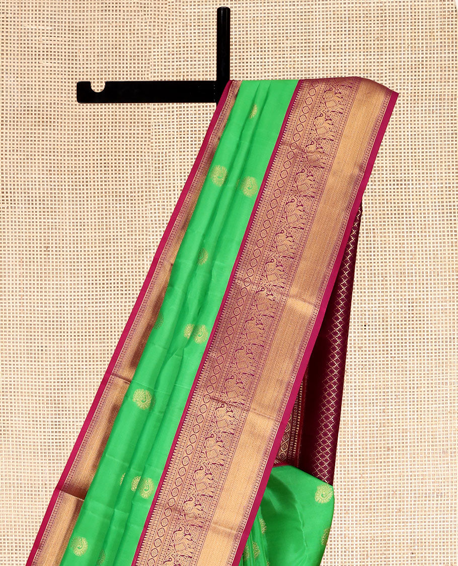 Green Vasundhara Lite Silk Mix Saree, Embellished with Zari Buttas, a Contrast Border of Banaras, Poun, Kamalam, Yaanai, and Mayil Kann Designs, Grand Pallu, and a Contrast Blouse