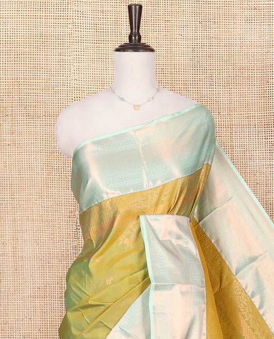 Green Budget Silk Saree, Decked Up with Zari Buttas All Over Its Body, Complemented by a Contrast Traditional Zari Design Border, Intricately Zari Designed Pallu, and Paired with a Contrast Blouse
