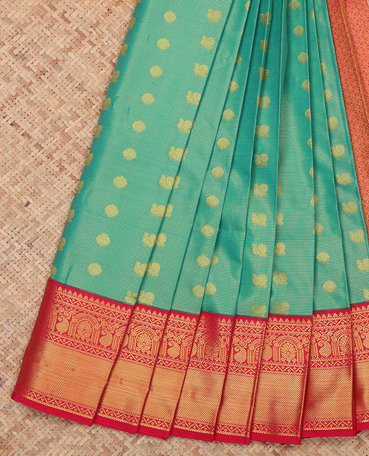 Green Budget Silk Saree, Gleamed Up with Peacock-Chakram Buttas, a Contrast Traditional Zari Border, Grand Pallu, and a Contrast Blouse