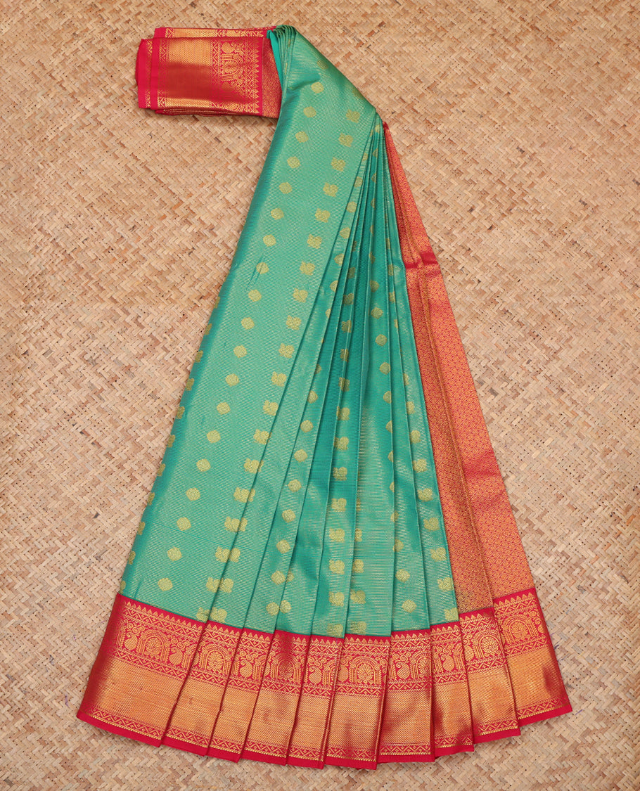 Green Budget Silk Saree, Gleamed Up with Peacock-Chakram Buttas, a Contrast Traditional Zari Border, Grand Pallu, and a Contrast Blouse