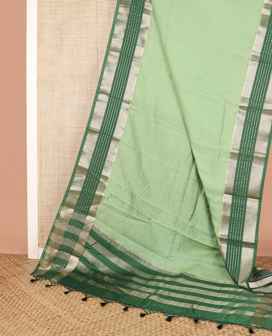 Green plain assam silk saree, contrast traditional zari border, and pallu of zari stripes