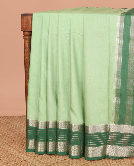 Green plain assam silk saree, contrast traditional zari border, and pallu of zari stripes