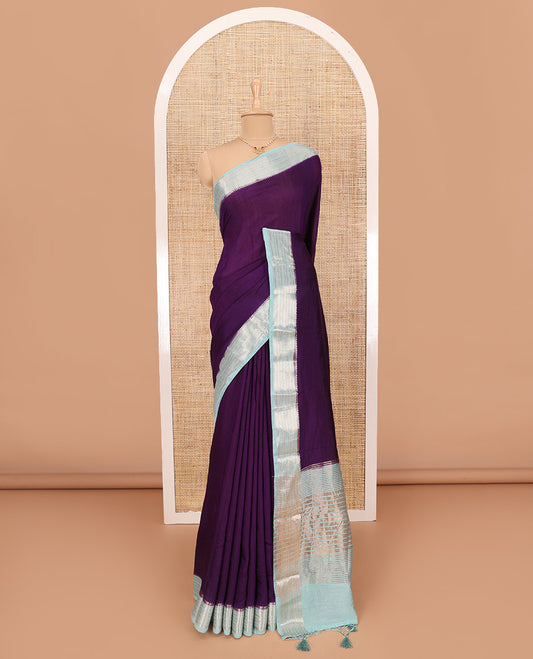 Eggplant Purple Plain Assam Silk Saree, Complemented by Contrast Traditional Zari Design Border, Pallu Trimmed with Zari Stripes, and Paired with a Contrast Blouse