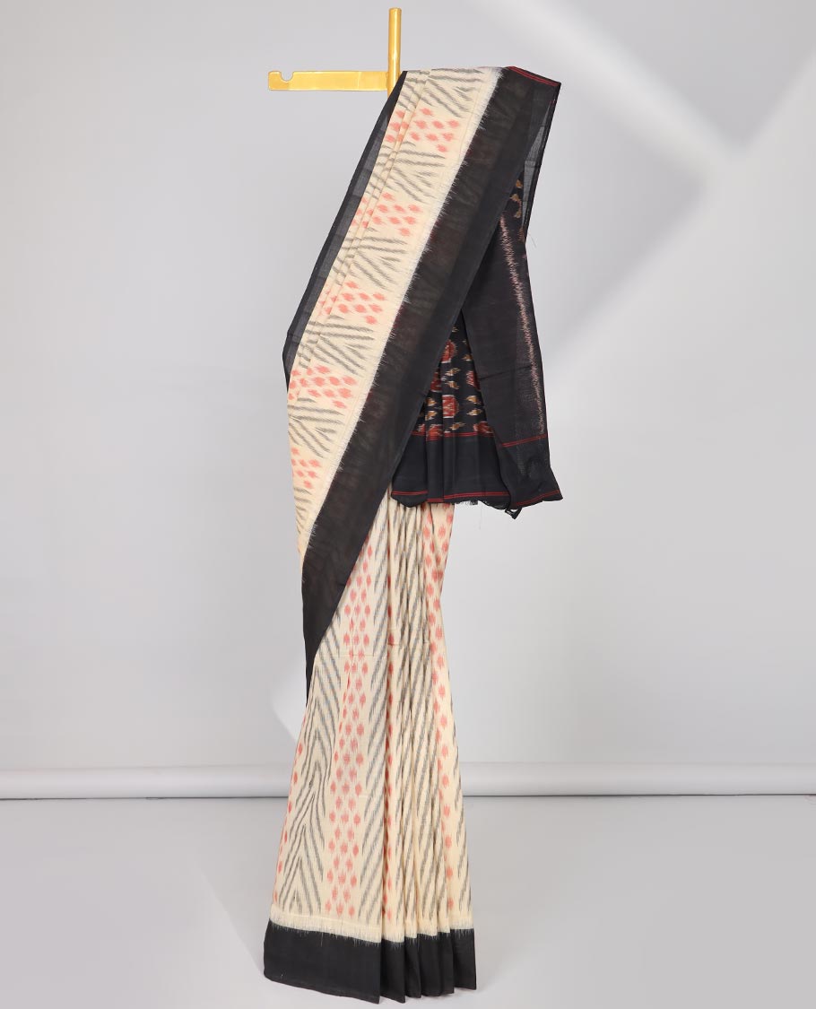 Cream geometric design Ikkat cotton saree with contrast plain border & intricate butta design pallu