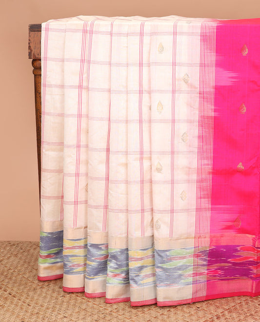White buttas and checked poly cotton saree, contrast ikkat border, and striped pallu