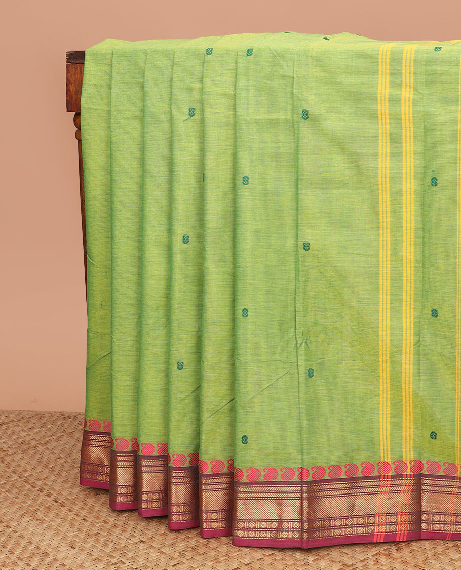 Green buttas Chettinad cotton saree, contrast traditional design border, and striped pallu